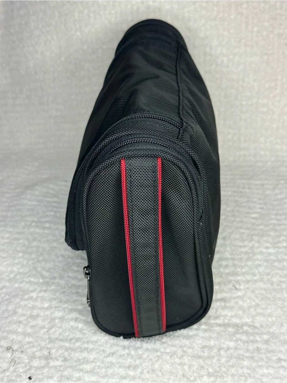 Tumi Black Toiletry Bag with Red Accents